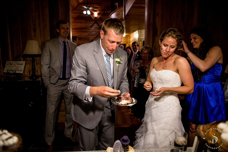 cake eating - Lake House on Bulow - Charleston Wedding Photography - Jody and Joe