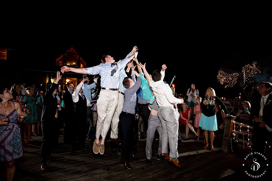 garter catch - Lake House on Bulow - Charleston Wedding Photography - Jody and Joe